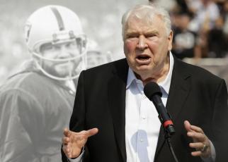 Former Oakland Raiders head coach John Madden speaks about former quarterback Ken Stabler, pictured at rear, at a ceremony honoring Stabler during halftime of a game between the Raiders and the Cincinnati Bengals on Sept. 15, 2015, in Oakland, Calif. (AP File)