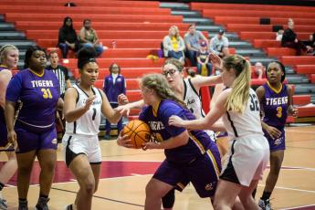 Fort White’s Ciara Byrd (1), Lisa Gall (middle) and Kaysen Wilcox (32) surround a Union County player on defense on Tuesday night. (CHRISTINA FEAGIN/Special to the Reporter)