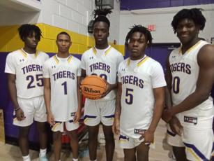 Columbia recognized seniors Ke’juan Paige (from left), Caden Perry, Brae Deal, Jerome Fulton and Marcus Peterson before Friday night’s game. (CONCEPCION LEDEZMA/Special to the Reporter)