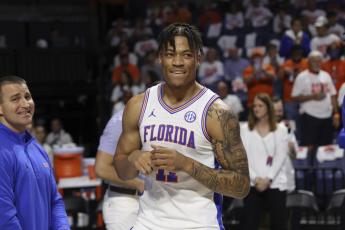 Florida forward Keyontae Johnson (11) smiles after being introduced as a starter before Saturday’s game against Kentucky in Gainesville, Fla. (MATT STAMEY/Associated Press)