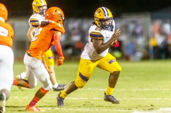 Columbia running back Tony Fulton rushes up the field against Orange Park last season. The two teams will play in District 3-3S this season with Middleburg and Ridgeview. (FRAN RUCHALSKI/Special to the Reporter)