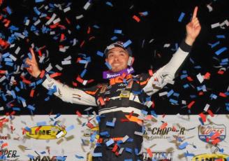 Kyle Larson celebrates amongst falling confetti after winning the General Tire Winter Nationals at All-Tech Raceway on Jan. 23, 2021. (FILE)