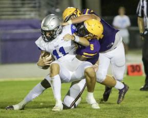 Columbia linebacker Jaden Robinson takes down Bartram Trail quarterback Riley Trujillo during the teams' spring game on Friday night. (BRENT KUYKENDALL/Lake City Reporter)