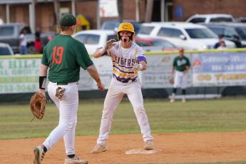 Columbia’s Truitt Todd celebrates on second base after hitting a two-RBI double against Mosley in the Region 1-5A semifinals on Thursday night. (BRENT KUYKENDALL/Lake City Reporter)