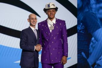 Paolo Banchero, right, poses for a photo with NBA Commissioner Adam Silver after being selected as the number one pick overall by the Orlando Magic in the NBA draft on Thursday in New York. (JOHN MINCHILLO/Associated Press)