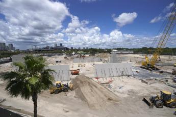 Workers continue construction of the Jacksonville Jaguars Sports Performance Center on May 31 in Jacksonville. The center, scheduled to be completed in 2023, includes nearly 130,000 square feet of space that will house new meeting rooms, weight rooms, locker rooms and practice fields. (JOHN RAOUX/Associated Press)