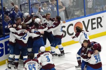 The Colorado Avalanche celebrate after defeating the Tampa Bay Lightning in Game 6 of the Stanley Cup Final on Sunday in Tampa. The Avalanche won 2-1 to win their third Stanley Cup. (JOHN BAZEMORE/Associated Press)