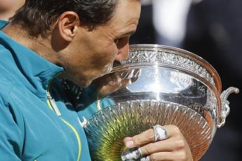 Rafael Nadal kisses the cup after defeating Casper Ruud in their final match of the French Open at the Roland Garros Stadium on Sunday in Paris. Nadal won 6-3, 6-3, 6-0. (JEAN-FRANCOIS BADIAS/Associated Press)