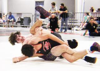 Columbia’s Alex Ulloa puts a Brother Martin wrestler in a spladle during the Jazz Town Duals this past weekend. (COURTESY)