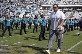 Former Jacksonville Jaguars player Tony Boselli is honored on the field during halftime of a game against the New Orleans Saints on Oct. 13, 2019, in Jacksonville. Boselli will be inducted into the Pro Football Hall of Fame on Aug. 6. (PHELAN M. EBENHACK/Associated Press)