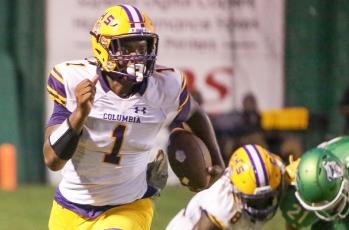 Columbia quarterback Tyler Jefferson carries the ball up the field during Friday’s Preseason Classic against Suwannee. (BRENT KUYKENDALL/Lake City Reporter)