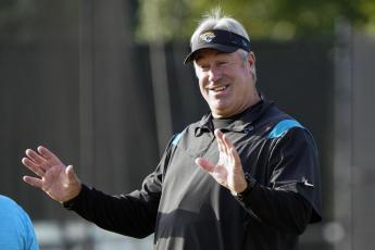 Jacksonville Jaguars head coach Doug Pederson greets players as they arrive at practice on Saturday in Jacksonville. (JOHN RAOUX/Associated Press)