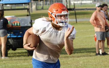 Branford running back Caden Coker carries the ball up the field during practice on Aug. 5. (JAMIE WACHTER/Lake City Reporter)