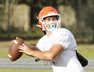 Branford quarterback Cohen David drops back to throw a pass during Friday’s practice. (JAMIE WACHTER/Lake City Reporter)