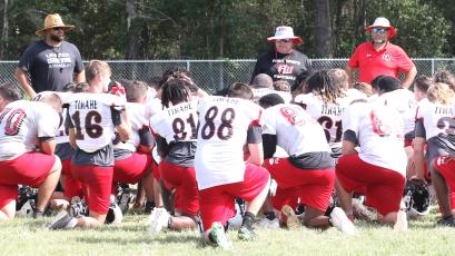 Fort White head coach Lee Dorsett speaks to his team following Wednesday’s practice. (MORGAN MCMULLEN/Lake City Reporter)