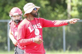 Lafayette head coach Marcus Edwards signals to players during Wednesday’s practice. (JAMIE WACHTER/Lake City Reporter)