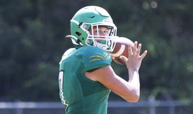 Suwannee quarterback Bronsen Tillotson sets to throw a pass during Thursday’s practice. (JAMIE WACHTER/Lake City Reporter)