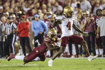 Florida State defensive back Omarion Cooper intercepts a pass intended for Boston College wide receiver Zay Flowers on Sept. 24 in Tallahassee. (GARY MCCULLOUGH/Associated Press)