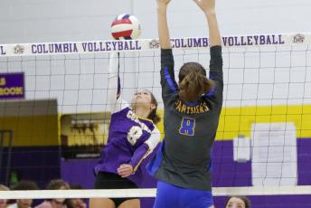 Columbia’s Haidyn Markham fires a shot over the net against Newberry on Tuesday night. (BRENT KUYKENDALL/Lake City Reporter)