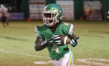 Suwannee running back Marquavious Owens runs up the field after a catch against Walton during last Friday’s Region 1-2S quarterfinals. (PAUL BUCHANAN/Special to the Reporter)