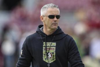 Florida State head coach Mike Norvell walks the field before Saturday’s game against Louisiana in Tallahassee. (GARY MCCULLOUGH/Associated Press)