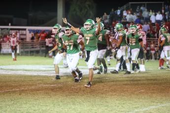Suwannee quarterback Bronsen Tillotson celebrates as he runs off the field in the closing seconds of the Bulldogs’ 10-7 win against  Bradford Friday night at Langford Stadium. (PAUL BUCHANAN/Special to the Reporter)