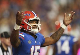 Florida quarterback Anthony Richardson celebrates after a touchdown against South Carolina on Saturday in Gainesville. (MATT STAMEY/Associated Press)