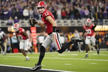 Georgia quarterback Stetson Bennett runs into the end zone for a touchdown against TCU the national championship on Monday in Inglewood, Calif. (ASHLEY LANDIS/Associated Press)