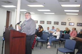 Columbia County Manager David Kraus answers questions about the county’s interest in Richardson Community Center at Tuesday’s meeting. (TONY BRITT/Lake City Reporter)