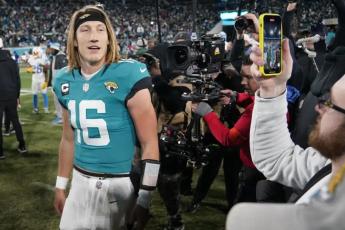 Jacksonville Jaguars quarterback Trevor Lawrence walks off the field after Saturday's wild-card playoff game against the Los Angeles Chargers in Jacksonville. The Jaguars won 31-30. (CHRIS CARLSON/Associated Press)