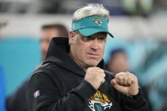 Jacksonville Jaguars head coach Doug Pederson walks the turf before his team’s wild-card playoff game against the Los Angeles Chargers last Saturday in Jacksonville. (JOHN RAOUX/Associated Press)