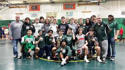 Suwannee’s wrestling team celebrates after winning the District 2-1A duals on Thursday. (COURTESY)