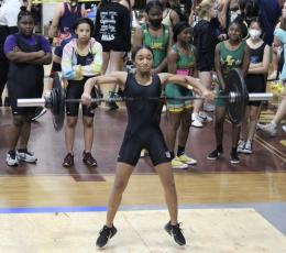 Columbia’s Sakiya Merriex performs the clean and jerk during Wednesday’s Region 1-2A meet. (COURTESY)