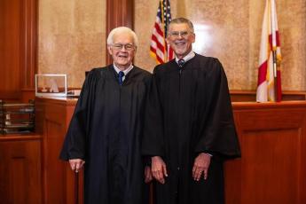 Retired Circuit Judge Paul Bryan (right) remembered Judge John Peach as ‘a fine gentleman’ after Peach’s death Wednesday. (COURTESY)