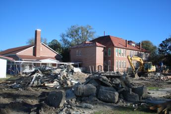 An excavator is pictured near ‘The Fort’ on the Fort White Elementary School campus on Monday afternoon. (TONY BRITT/Lake City Reporter)
