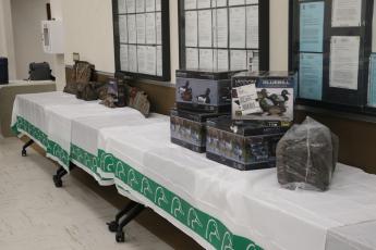 The Suwannee River Chapter of Ducks Unlimited set up raffle prizes ahead of Friday's annual banquet. (MORGAN MCMULLEN/Lake City Reporter)