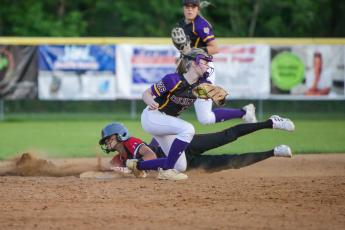 Middleburg's Mika Wesley slides safely into second base before Columbia shortstop Anna Dansby can apply a tag on Friday night. (BRENT KUYKENDALL/Lake City Reporter)