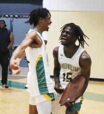 FGC guards Jeremy Young (left) and Maurice Campbell (right) celebrate after defeating Pitt CC in the South Atlantic District B championship on Saturday. (JORDAN KROEGER/Lake City Reporter)
