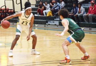 FGC guard Amayoaah Phillips initiates the action against Palm Beach State on Feb. 15. (COURTESY OF FGC)