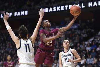 Florida State’s Ta’niya Latson goes up for a basket as Connecticut’s Lou Lopez-Senechal (11) defends on Dec. 18, 2022, in Uncasville, Conn. (JESSICA HILL/AP File)