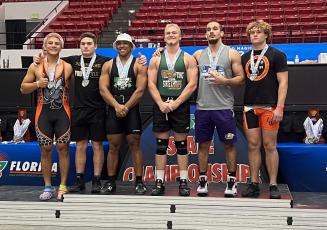 Columbia's Zaher Darwiche (second from right) placed third in the 199 class in Olympic at the Class 2A state meet on Saturday. (COURTESY)