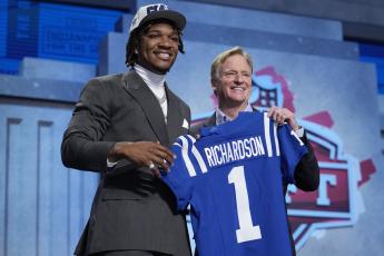 Florida quarterback Anthony Richardson (left) poses with NFL Commissioner Roger Goodell after being chosen by the Indianapolis Colts with the fourth overall pick during the first round of the NFL draft on Thursday in Kansas City, Mo. (JEFF ROBERSON/Associated Press)
