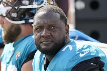 Jacksonville Jaguars offensive tackle Cam Robinson watches play against the New York Giants on Oct. 23, 2022, in Jacksonville. (JOHN RAOUX/AP File)