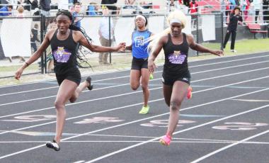 Columbia’s J’Liyn Smith wins the 200m run just ahead of teammate Stacy White at Middleburg’s Bronco Bob Invitational on Thursday. (COURTESY)