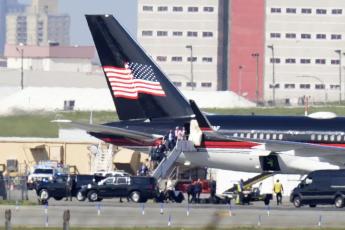 Former President Donald Trump’s aides and legal team exit his plane Monday in New York. Trump arrived for his expected booking and arraignment on charges arising from hush money payments during his 2016 campaign. (FRANK FRANKLIN II/Associated Press)