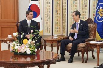 Florida Gov. Ron DeSantis talks with South Korean Prime Minister Han Duck-soo on Wednesday as part of a four-nation trade mission trip. (COURTESY Office of the Governor)