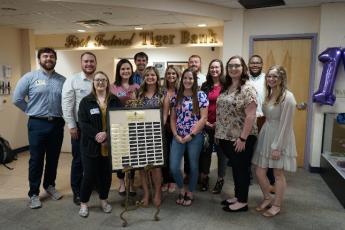 Past interns at the First Federal Tiger Bank at Columbia High School are pictured during the 15-year anniversary celebration. (COURTESY)