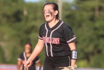 Fort White pitcher Kadence Compton celebrates after a strikeout against Union County in the District 6-1A semifinals on Tuesday night. (PAUL BUCHANAN/Special to the Reporter)