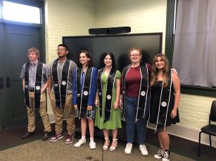 North Florida College Sentinel Scholars Collegiate Academy students are all smiles after receiving their custom stoles to wear during graduation. Pictured are Brice Criggall (from left), Juan Sandoval, Ariana Lane, Cayla Anastasio, Gracie Clements and Laura Watson. Not pictured is Emma Clary. (COURTESY)