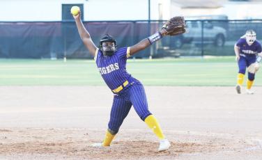 Columbia pitcher Zoryana Hughes winds up to pitch against Middleburg in the District 2-5A semifinals on Tuesday night. (MORGAN MCMULLEN/Lake City Reporter)